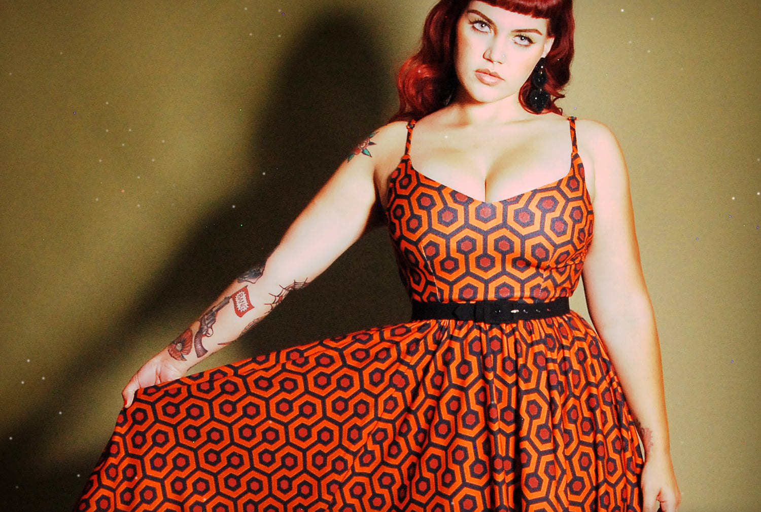 Woman in a dress in hotel hexagon print